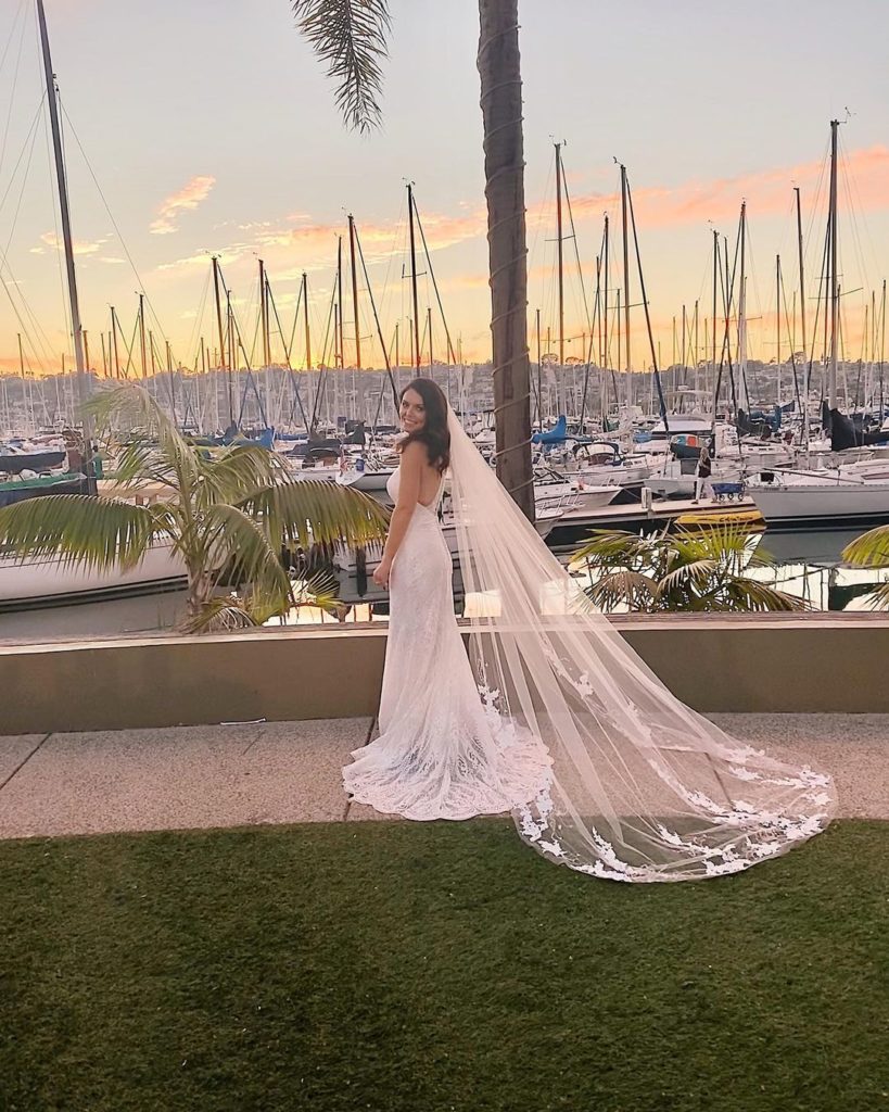 Bride standing next to marina